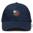 The NYC British and Irish Selects Flexfit Drill Cap by EMB Canterbury is navy blue with an embroidered crest saying "NYC British & Irish Selection Rugby" in white, red, orange, and green.