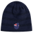 The New Zealand Shield Beanie by EMB Canterbury is a dark blue knit with subtle stripes and an emblem reminiscent of a stylized flag, featuring a red and white design on a blue background.