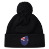 The New Zealand Shield Pom Pom Beanie by EMB Canterbury in black combines warmth with national pride, featuring a stylish badge.