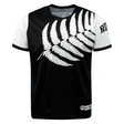 A black and white t-shirt featuring a large white fern leaf design across the front, with "New Zealand" text partially visible at the collar and "Rugby" text on the right sleeve, this **Nations of Rugby New Zealand 7s Rugby Flag Supporters Jersey** by **Admiral** is perfect for 7s rugby supporters.