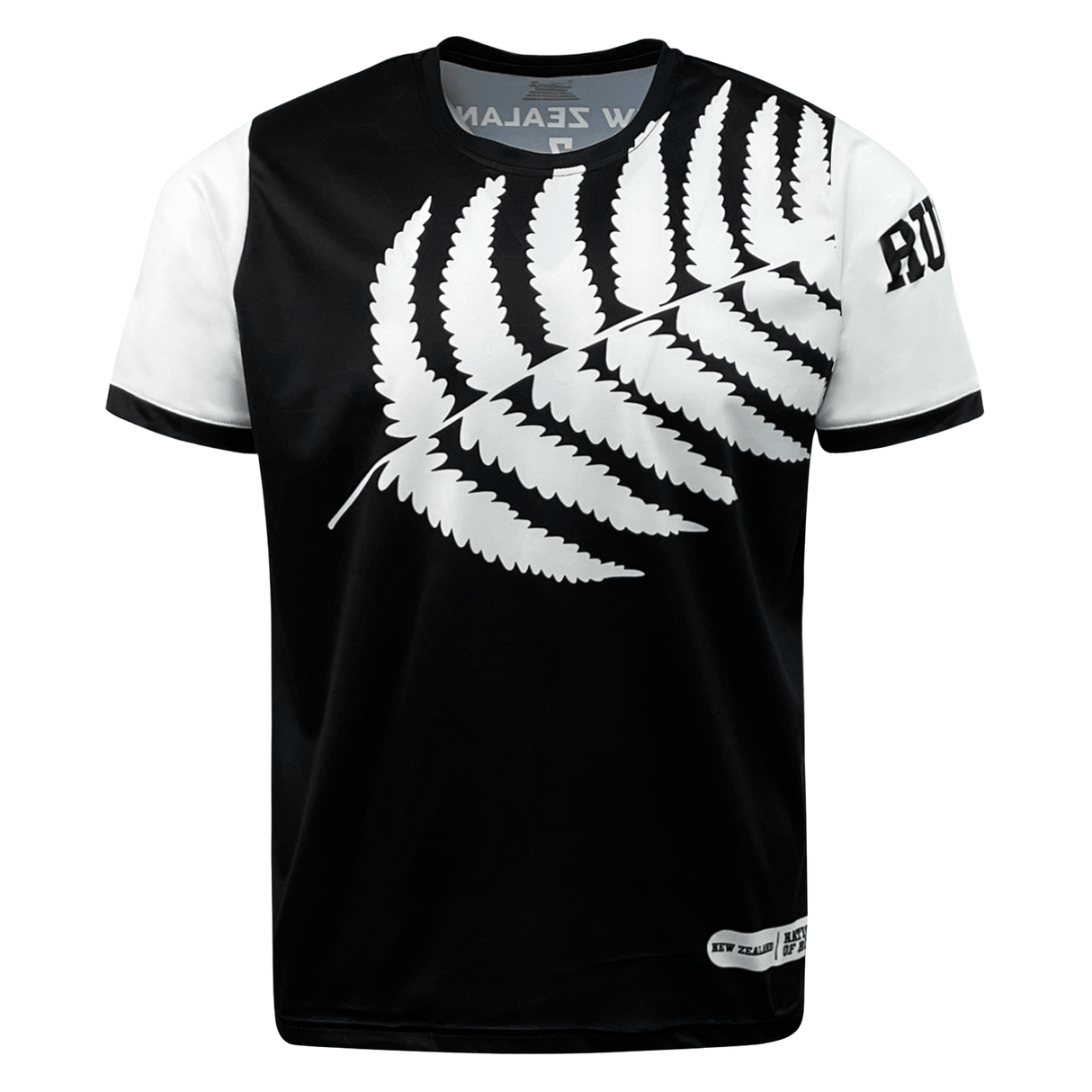 A black and white t-shirt featuring a large white fern leaf design across the front, with "New Zealand" text partially visible at the collar and "Rugby" text on the right sleeve, this **Nations of Rugby New Zealand 7s Rugby Flag Supporters Jersey** by **Admiral** is perfect for 7s rugby supporters.