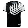 A black and white t-shirt featuring a large white fern leaf design across the front, with "New Zealand" text partially visible at the collar and "Rugby" text on the right sleeve, this **Nations of Rugby New Zealand 7s Rugby Flag Supporters Jersey** by **Admiral** is perfect for 7s rugby supporters.