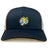 The EMB S&S Activewear Noble Street College Prep Retro Trucker Cap is a navy and white trucker hat with a yellow and blue embroidered tiger head logo on the front and a classic snapback closure.
