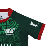 The Las Serpientes Mexico Rugby Replica Jersey by Credo Rugby features green fabric, red trim, white snake graphics, the word "Serpientes," and a bold front pattern—ideal for fans wanting an authentic replica from Credo Rugby.