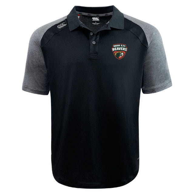 The Omaha Beavers RFC Elite Polo by EMB Canterbury is a lightweight black and gray collared shirt with the club logo on the chest, Canterbury logo on the shoulder, and made from breathable Vapodri fabric for comfort.