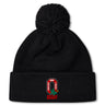 The Ohio State University Alumni Pom Pom Beanie by EMB Canterbury is a black, fleece-lined hat featuring an embroidered red and white "OSU Rugby 1966" logo and "Ohio State Rugby" text on the front, for extra warmth and comfort.