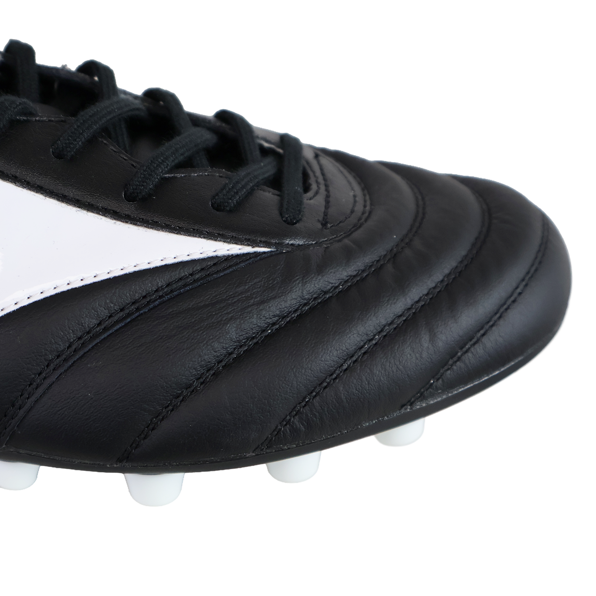 Close-up of the toe and laces of a black, white, and red Mizuno Morelia II Elite AG soccer cleat, highlighting kangaroo leather stitching detail and white sole studs.