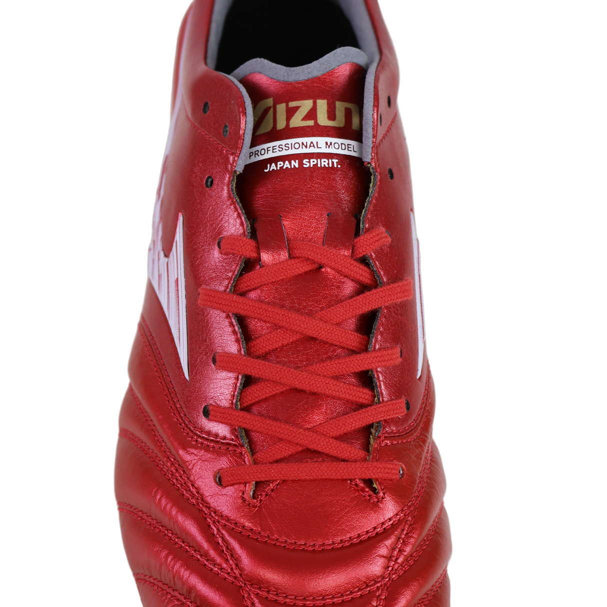 The Mizuno Morelia Neo IV FG Made in Japan - Morelia 40th Anniversary Red/White/Black soccer cleat is shown from above, highlighting the laces, branded tongue, and white Mizuno logo. Built for firm ground, it offers a barefoot feel for top control.