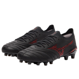 A pair of Mizuno Morelia Neo IV Beta FG Made in Japan soccer cleats in black with Morelia 40th Anniversary red accents and laces, crafted from premium kangaroo leather, is displayed on a white background.