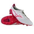 A pair of Mizuno Morelia Neo IV FG soccer cleats in White/Pink Tetra/Fuchsia Purple, featuring premium K-leather, a stylized Mizuno logo, and studded soles—one upright and one lying on its side.