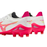 A pair of white and pink Mizuno Morelia Neo IV Beta Elite FG football boots with stud soles, viewed from the rear three-quarter angle.