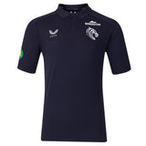 Experience the Leicester 26/27 Off Pitch Polo by Castore—a navy blue short-sleeve polo featuring sponsor and team logos on the chest and sleeve, a buttoned collar, and Castore’s signature rugby shirt style, perfect for showing your support off the pitch.