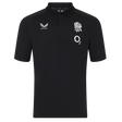 The England 26/27 Off-Pitch Polo by Castore is a black short-sleeve polo with a collar, featuring a white rose emblem, O2 logo, and Castore branding—perfect for showcasing your England Rugby style off the pitch.