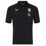The England 26/27 Off-Pitch Polo by Castore is a black short-sleeve polo with a collar, featuring a white rose emblem, O2 logo, and Castore branding—perfect for showcasing your England Rugby style off the pitch.