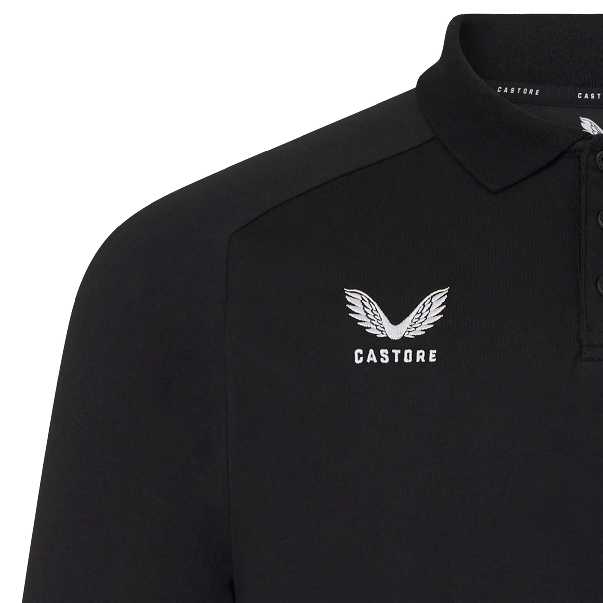Close-up of the England 26/27 Off-Pitch Polo by Castore, featuring a black design with white Castore logo and brand name on the left chest, plus a three-button placket and collar—ideal for versatile off-pitch style.