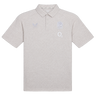 The England 26/27 Off-Pitch Polo by Castore features a light grey design with short sleeves, a collar, three buttons, and white embroidered logos—a rose, "O2," and stylized bird—ideal for an off-pitch England Rugby look.