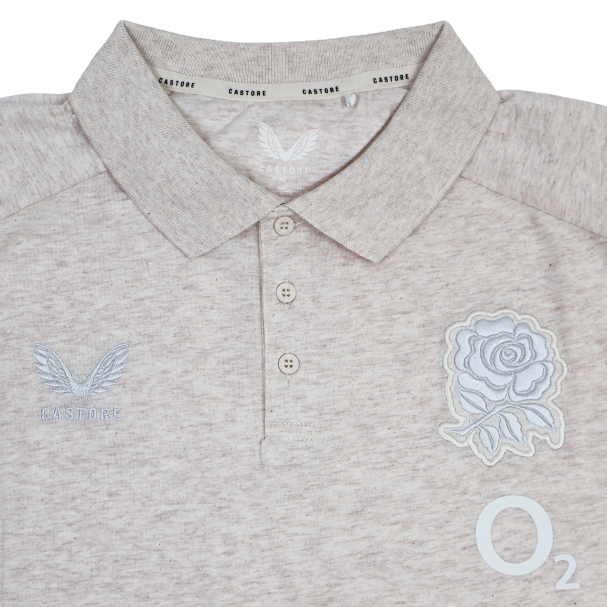 The England 26/27 Off-Pitch Polo by Castore features a beige design, three-button placket, rose emblem, Castore branding, and O2 logo—ideal for England Rugby fans looking for stylish off-pitch wear.