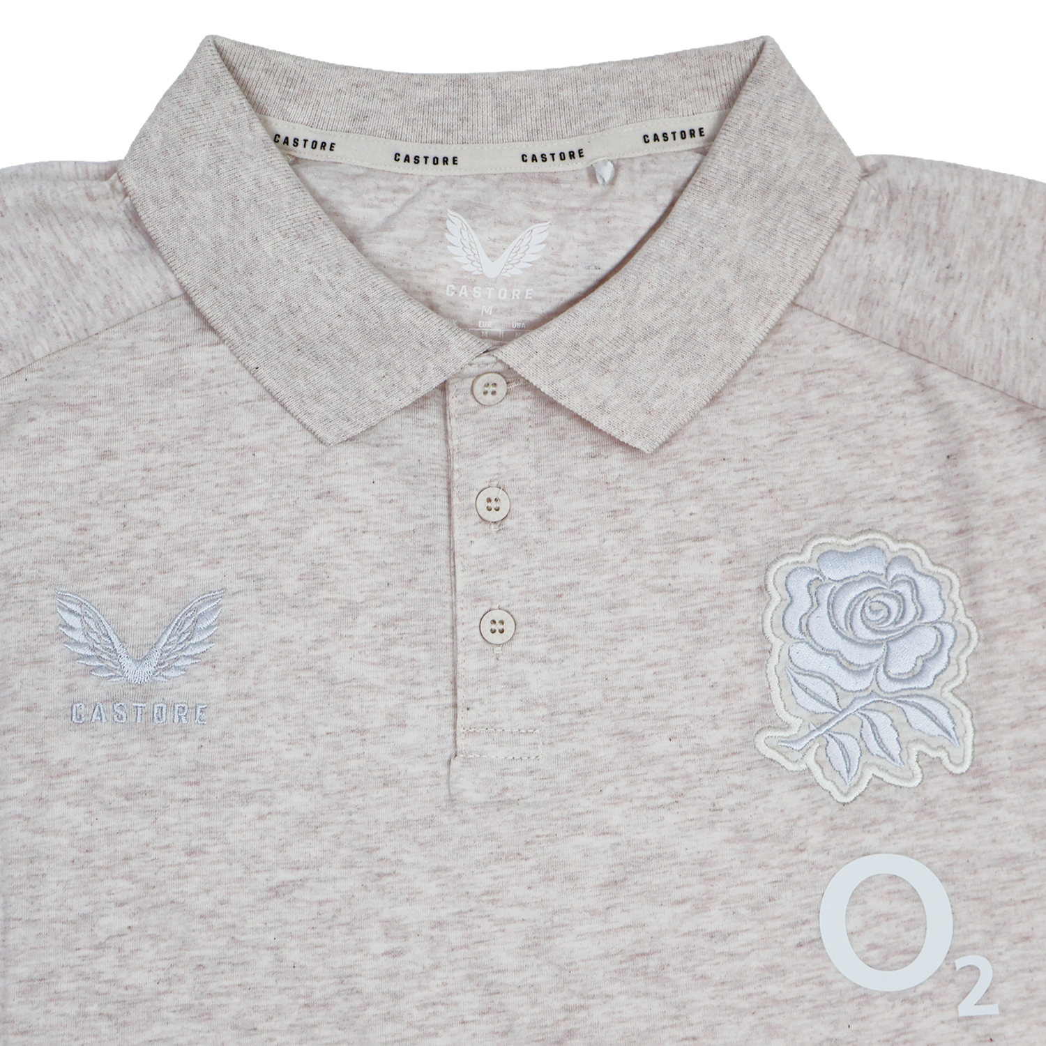 The England 26/27 Off-Pitch Polo by Castore features a beige design, three-button placket, rose emblem, Castore branding, and O2 logo—ideal for England Rugby fans looking for stylish off-pitch wear.