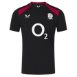 The England 26/27 Performance Training Tee by Castore features black short sleeves, red shoulder panels, a white "O2" sponsor logo, the rugby rose emblem, Castore branding, and moisture-wicking tech for comfort.