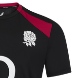 The England 26/27 Performance Training Tee by Castore is black with a white rose chest emblem, maroon shoulder detail, moisture-wicking tech, and features part of a large white number.