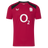 The England 26/27 Performance Training Tee by Castore features red short sleeves, black shoulder accents, a white O2 sponsor logo, moisture-wicking fabric, and the white rose England rugby emblem on the chest.