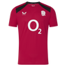 The England 26/27 Performance Training Tee by Castore features red short sleeves, black shoulder accents, a white O2 sponsor logo, moisture-wicking fabric, and the white rose England rugby emblem on the chest.