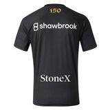 A black short-sleeve Saracens 26/27 Replica Home Jersey by Castore, part of the official home shirt collection, features “shawbrook” and “StoneX” logos on the back and a bold gold “150” at the top.