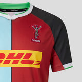 The Harlequins 26/27 Replica Home Jersey by Castore showcases a vibrant multi-color design, features the iconic Harlequins logo, a bold yellow DHL sponsor emblem across the chest, and is expertly crafted by Castore—making it an ideal men’s home shirt for passionate fans.