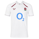 Wear your pride with the England 26/27 Replica Home Jersey by Castore—an official England Rugby jersey featuring a crisp white short-sleeve design, the iconic red rose crest, bold blue “O2” sponsor logo, and striking maroon accents on the collar and shoulders.