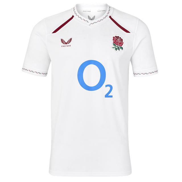 Wear your pride with the England 26/27 Replica Home Jersey by Castore—an official England Rugby jersey featuring a crisp white short-sleeve design, the iconic red rose crest, bold blue “O2” sponsor logo, and striking maroon accents on the collar and shoulders.
