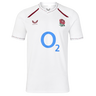Wear your pride with the England 26/27 Replica Home Jersey by Castore—an official England Rugby jersey featuring a crisp white short-sleeve design, the iconic red rose crest, bold blue “O2” sponsor logo, and striking maroon accents on the collar and shoulders.