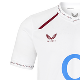 The England 26/27 Replica Home Jersey by Castore features a white design with maroon trim, the signature Castore logo on the chest, and part of a bold blue “O” on the front—making it the perfect choice for dedicated England Rugby fans seeking an authentic replica home jersey.