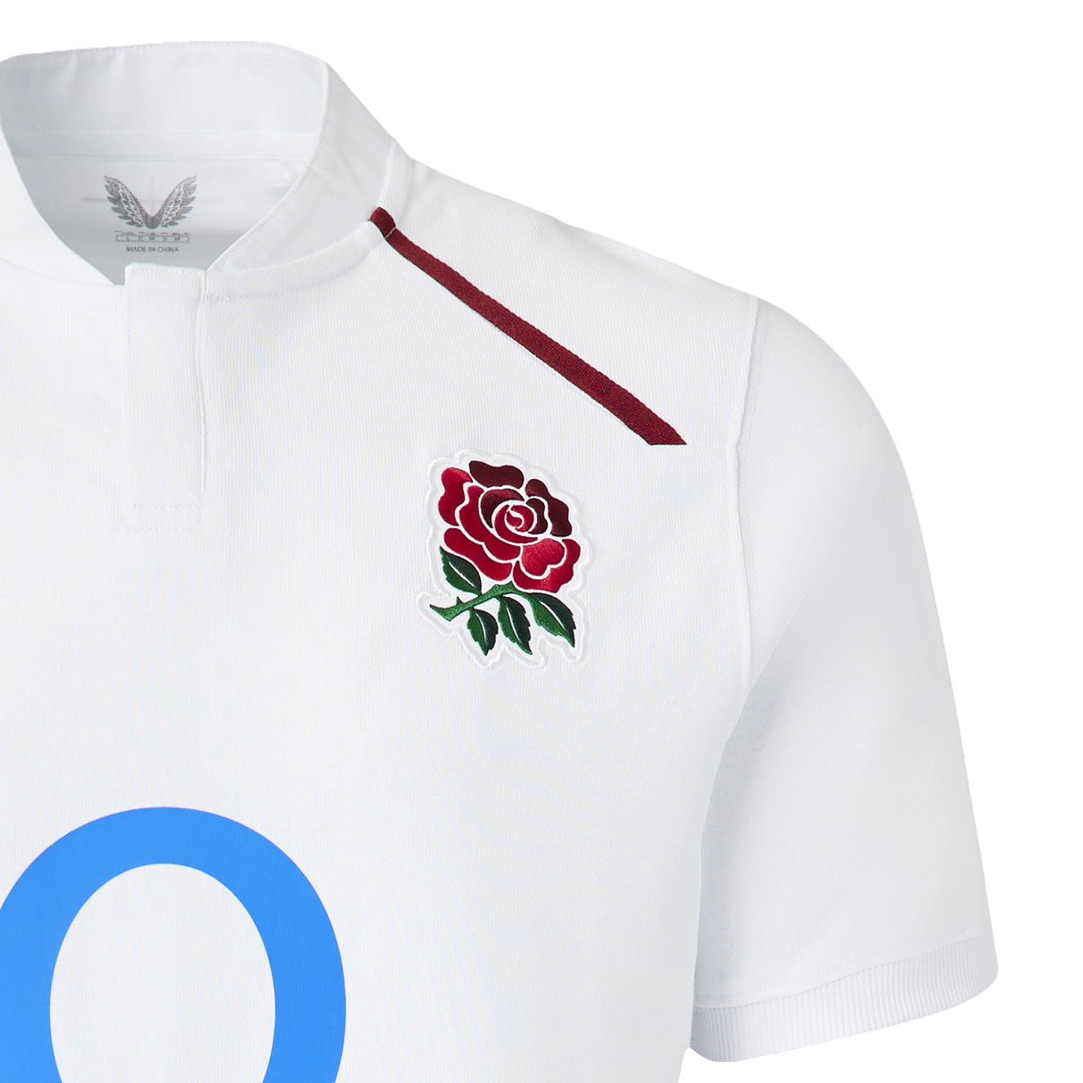 The England 26/27 Classic Home Jersey by Castore features a white design with a maroon rose emblem, thin maroon shoulder stripe, and a large blue "O"—a must-have for rugby fans.