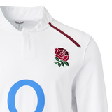 The England 26/27 Classic Long Sleeve Home Jersey by Castore features a red rose chest emblem, maroon shoulder stripe, and a bold blue "O" partly shown on the front.