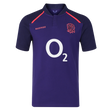 The England 26/27 Classic Alternate Jersey by Castore is a dark purple rugby top with short sleeves, a red rose crest, white "O2" sponsor logo, and Castore branding—ideal for England Rugby fans.