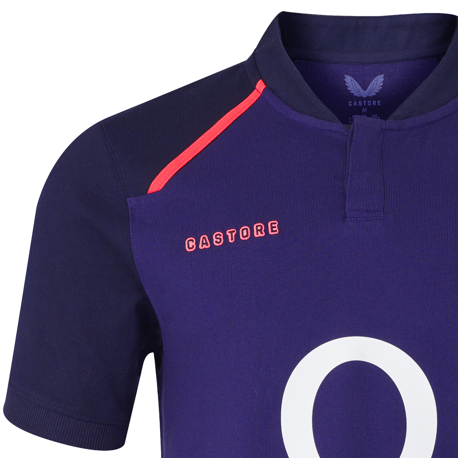 A close-up of the Castore England 26/27 Classic Alternate Jersey shows navy blue fabric, a bold red shoulder accent, and the number "0" partially visible on the front.