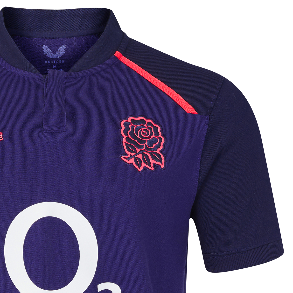 A close-up of the England 26/27 Classic Alternate Jersey by Castore in navy, showcasing the red rose emblem, red shoulder stripes, and a partial white "O2" logo—iconic elements from the Castore brand.