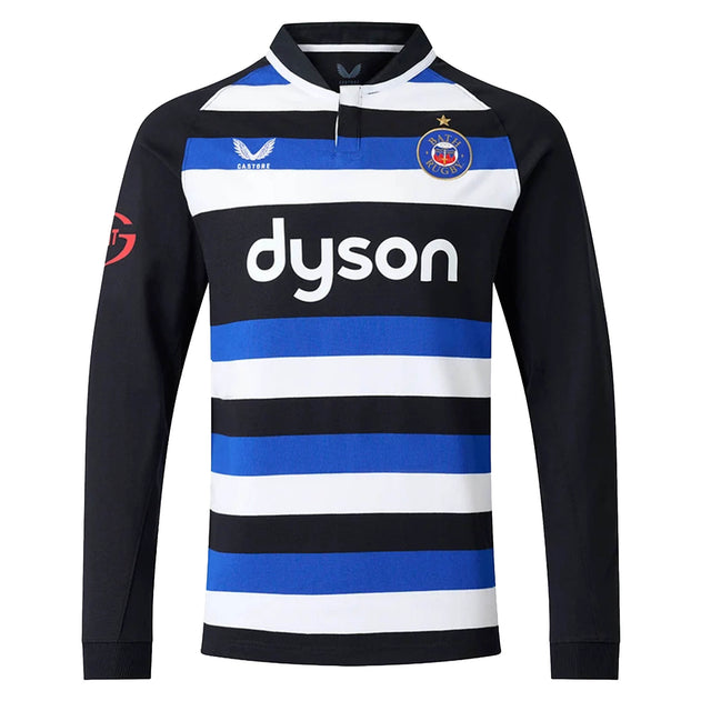 The Bath 26/27 Classic Long Sleeve Home Jersey by Castore features black, blue, and white horizontal stripes, a “dyson” sponsor logo, star and crest on the chest, and black sleeves—a timeless heritage rugby shirt from Castore.