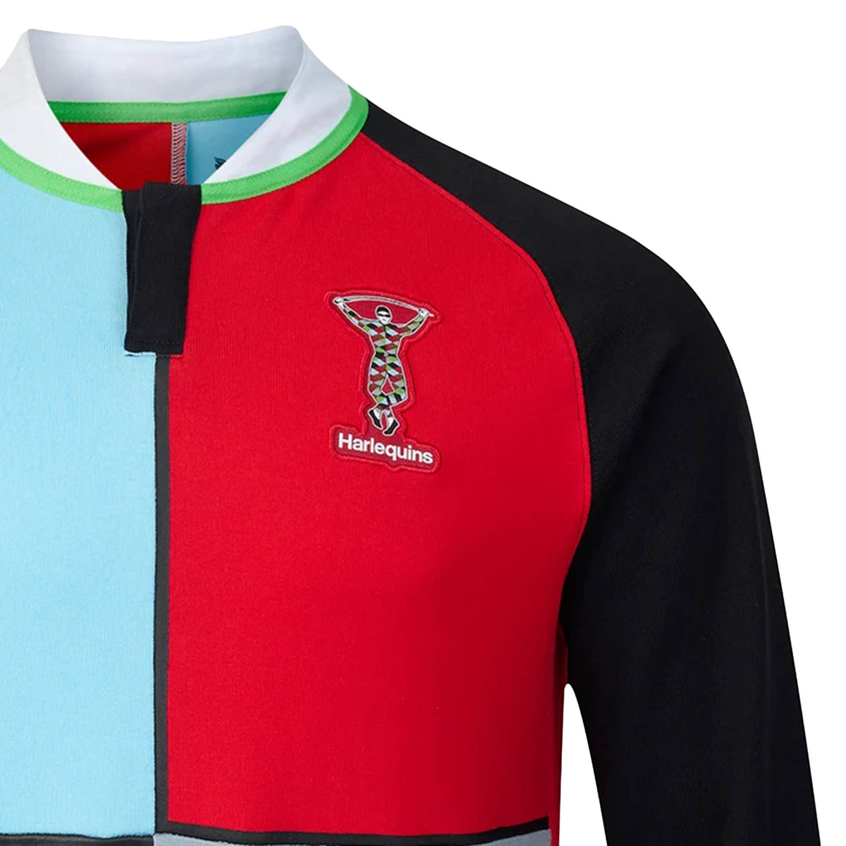 Close-up of the Harlequins 26/27 Classic Long Sleeve Home Jersey by Castore, showcasing multicolored panels, the club’s logo on the left chest, and a black, white, and green collar—a modern rugby shirt by Castore inspired by classic vintage styles.