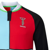 Close-up of the Harlequins 26/27 Classic Long Sleeve Home Jersey by Castore, showcasing multicolored panels, the club’s logo on the left chest, and a black, white, and green collar—a modern rugby shirt by Castore inspired by classic vintage styles.