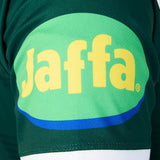 Close-up of a green sleeve from the Leicester 26/27 Replica Home Jersey by Castore, featuring a large yellow “Jaffa” logo printed on an oval green and blue background.