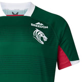 The Leicester 26/27 Replica Home Jersey by Castore features a green and red design with a white roaring lion logo, “Breedon” sponsor text, and a white collar, authentically styled as the team’s home jersey.