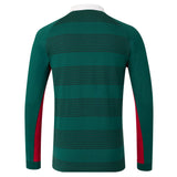 The Leicester 26/27 Classic Long Sleeve Home Jersey by Castore features long sleeves, a green base with horizontal black stripes, red side panels, and a white collar, shown from the back—its design is inspired by classic Leicester Tigers jerseys.