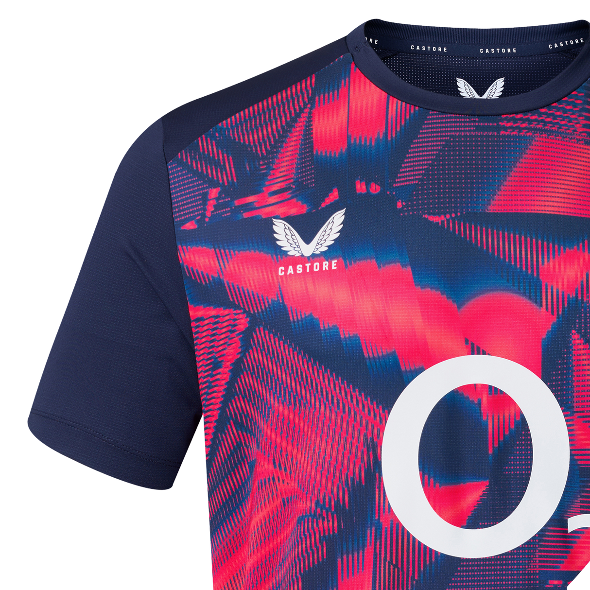 Close-up of the England 26/27 Pre-Match Top by Castore, showcasing bold red and blue abstract patterns, navy sleeves, a white "O" on the front, and the Castore logo near the collar.