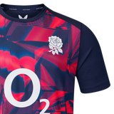Close-up of the England 26/27 Pre-Match Top by Castore, displaying a red and blue geometric pattern, white rose chest emblem, and O2 branding.