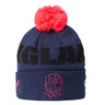 Stay warm and show your support with the England 26/27 Bobble Beanie by Castore. Featuring a navy blue knit, a vibrant red pom-pom, bold black “ENGLAND” lettering, and an embroidered red rose emblem on the front cuff, this Castore beanie is the ideal winter accessory for any England rugby fan.