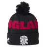The England 26/27 Bobble Beanie by Castore is a black knit beanie featuring a pom-pom, bold red “ENGLAND” lettering, and a white rose emblem on the fold—an essential winter accessory for England supporters and the perfect Castore beanie for chilly rugby match days.