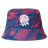 The Castore England 26/27 Reversible Bucket Cap features blue and red patterns and a white embroidered rose on the front, taking inspiration from the iconic England rugby cap.