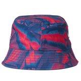 The England 26/27 Reversible Bucket Cap by Castore, featuring a blue and red abstract pattern with a flat top and downward sloping brim, is displayed against a plain white background.