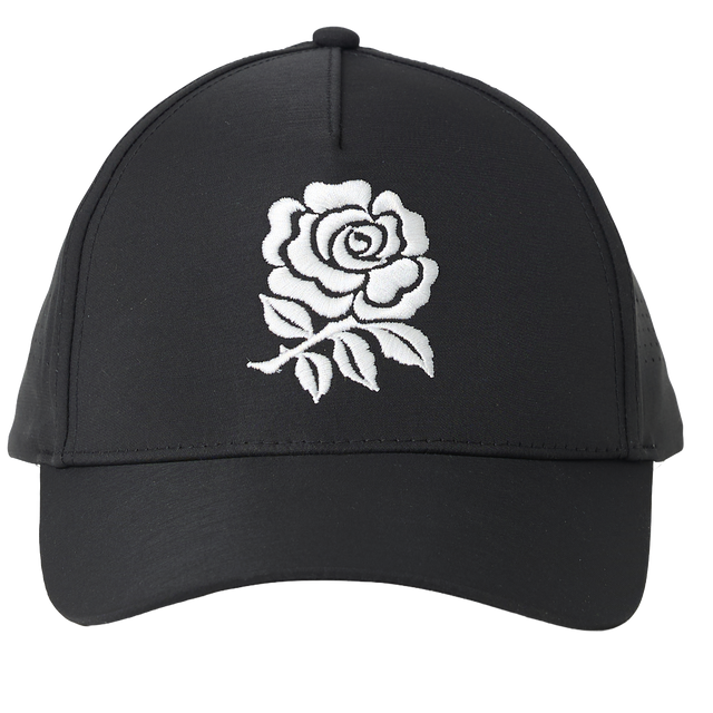 England 26/27 Team Cap by Castore — a black cap featuring a white embroidered rose design on the front panel, inspired by the iconic England Rugby style, displayed against a plain white background.